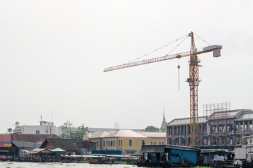 Fototapeta na wymiar Construction crane and sky background