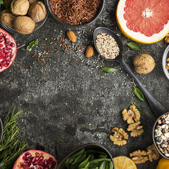 Ingredients of a healthy diet for drawing up a meal plan: wild brown rice, quinoa, spinach, legumes, oranges, grapefruit, almonds, walnuts. Top View .copy space
