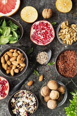 Ingredients of a healthy diet for drawing up a meal plan: wild brown rice, quinoa, spinach, legumes, oranges, grapefruit, almonds, walnuts. Top View .copy space