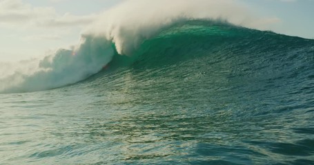 Giant ocean wave breaking at susnet - Powered by Adobe