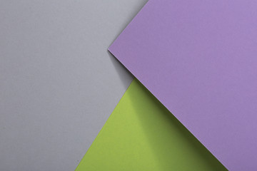 Colored paper composition soft purple, fresh green and gray paper, design elements