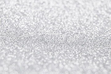 White and silver glitter background. Selective focus. Winter christmas background. Happy new year and christmas concept.