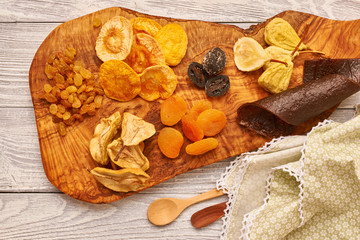 Dried fruits on wooden background