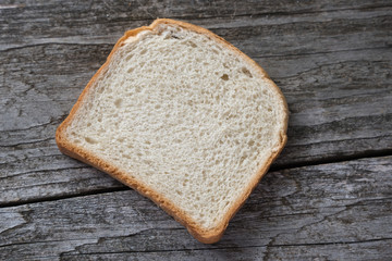 Slice of bread on the gray table.