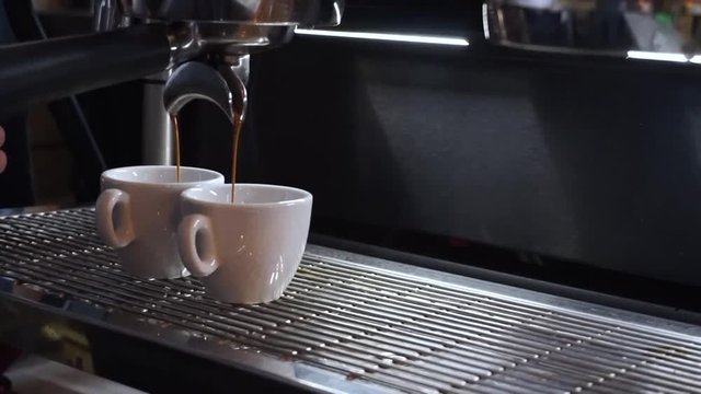 Professional coffee machine making double espresso coffee
