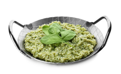Dish with delicious spinach risotto on white background