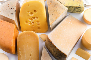Variety of cheese on light background