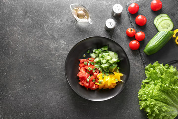 Composition with ingredients for tasty vegetable salad on table