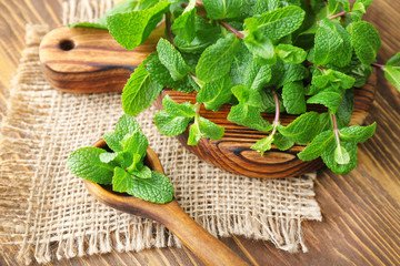 Kitchenware with fresh lemon balm on table