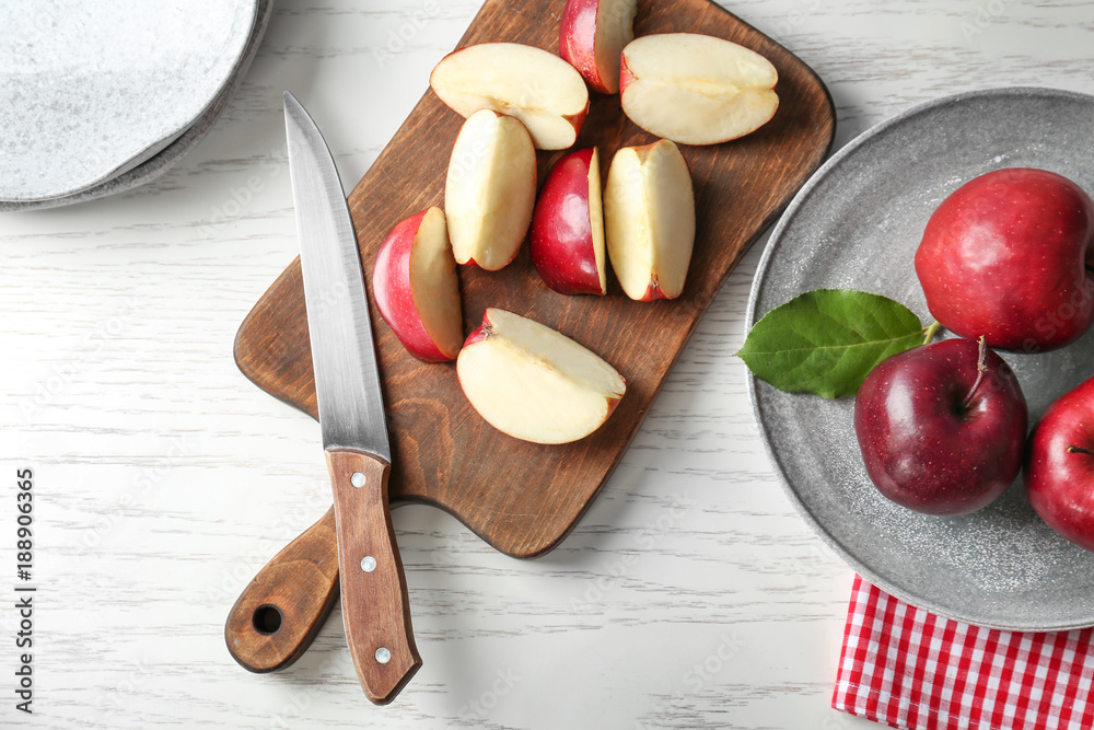 Canvas Prints plate and wooden board with ripe red apples on table