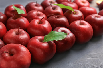 Fresh ripe red apples on table