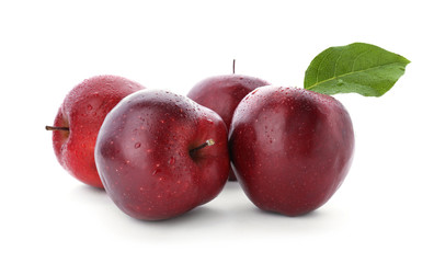 Ripe red apples on white background