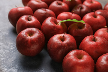 Fresh ripe red apples on table, closeup