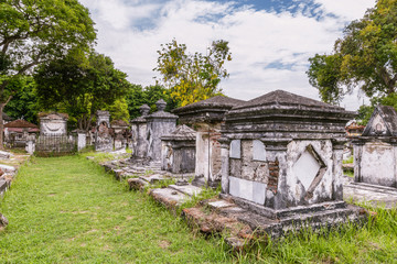 Fototapeta na wymiar Ancient Dutch cemetery from the colonial times in Peneleh, Surabaya, Java island, Indonesia
