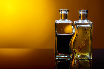 Bottles of flavored olive oil and balsamic vinegar .