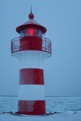 Lighthouse with light in winter