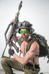 Modern soldier in an unusual helmet and with an unusual automatic weapon
