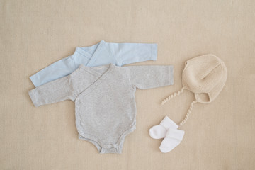 newborn baby clothes - studio shot from above
isolated little silk body on natural woolen...