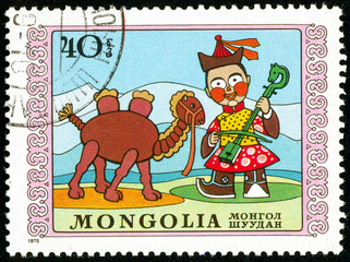 Ukraine - circa 2018: A postage stamp printed in Mongolia show the child plays a stringed musical...