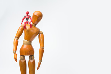 Red android robot or Artificial intelligence in wooden figure body on white background.