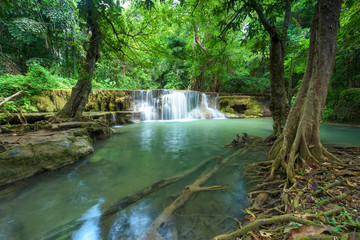 Naklejka premium Waterfall in rainforest at National Park, Thailand.