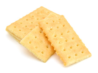 Salty crackers in square shape on white background