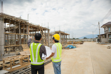 Asian business man construction engineer workers at house building site