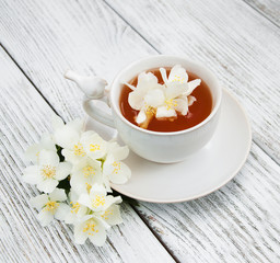 Cup of tea with jasmine flowers