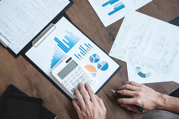 Co working conference, Business team meeting present, investor colleagues discussing new plan financial graph data on office table with laptop and digital tablet, Finance, accounting, investment