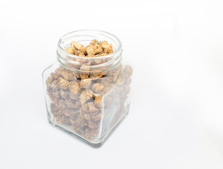 Dried chrysanthemum flowers in Bottle on white background
