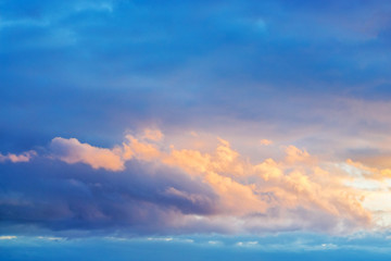 the sky during sunset, covered with bright, clearly expressed torn storm clouds