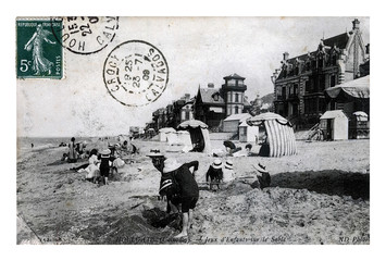 kids on the sand beach, Houlgate (Calvados), vintage postcard of France, circa 1909. active children in retro fashion skirt and hats.