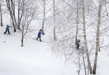Naklejka na ściany i meble children skiing on the white snow