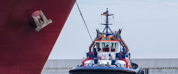Fototapeta premium TUG AND GAS CARRIER - Tug when working with a big ship