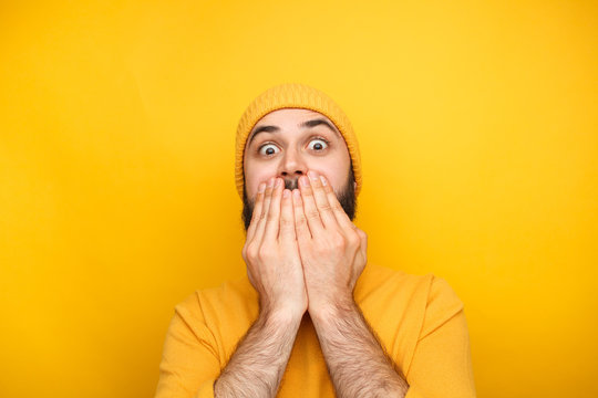 Frightened man in yellow clothes
