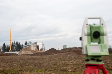 measuring construction in the beckground