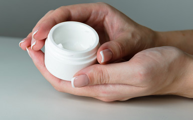 beautiful woman hands with cream