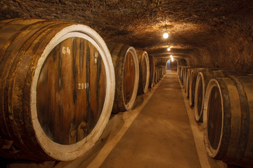 barrels with the wine in the old basement.