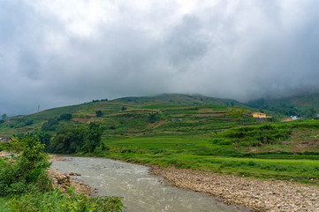 Spectacular landscape of mountain valley with river and rice terraces