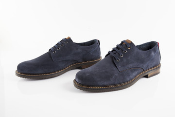 Male blue leather shoe on white background, isolated product, comfortable footwear.