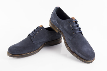 Male blue leather shoe on white background, isolated product, comfortable footwear.