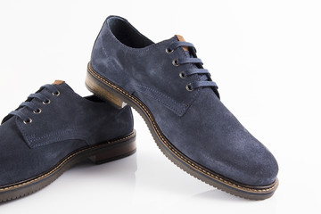 Male blue leather shoe on white background, isolated product, comfortable footwear.