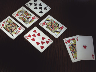 poker cards on the wooden table, flush royal