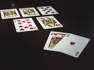 close up poker cards on the wooden table, flush royal