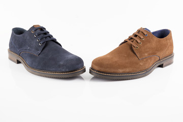 Male brown and blue leather shoe on white background, isolated product, comfortable footwear.