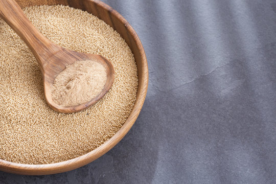 Amaranth seeds and flour in the wooden bowl - Amaranthus