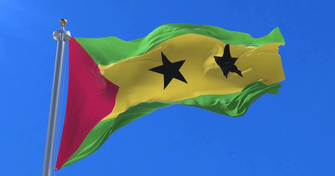 Flag of S&atilde;o Tom&eacute; and Pr&iacute;ncipe waving at wind in slow with blue sky, loop