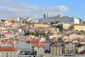 Cityscape of Lisbon, Portugal.  Brightly Coloured Buildings.  Monastery of Sao Vicente de Fora on Skyline