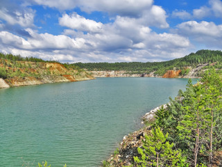 The turquoise quarry lake. Lipovsky quarry. Sverdlovsk region. Russia