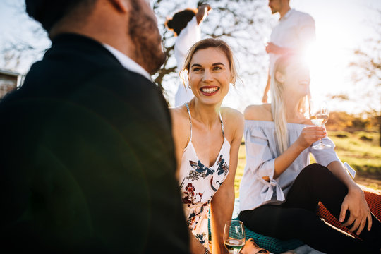 Group of friends hanging out at outdoors party